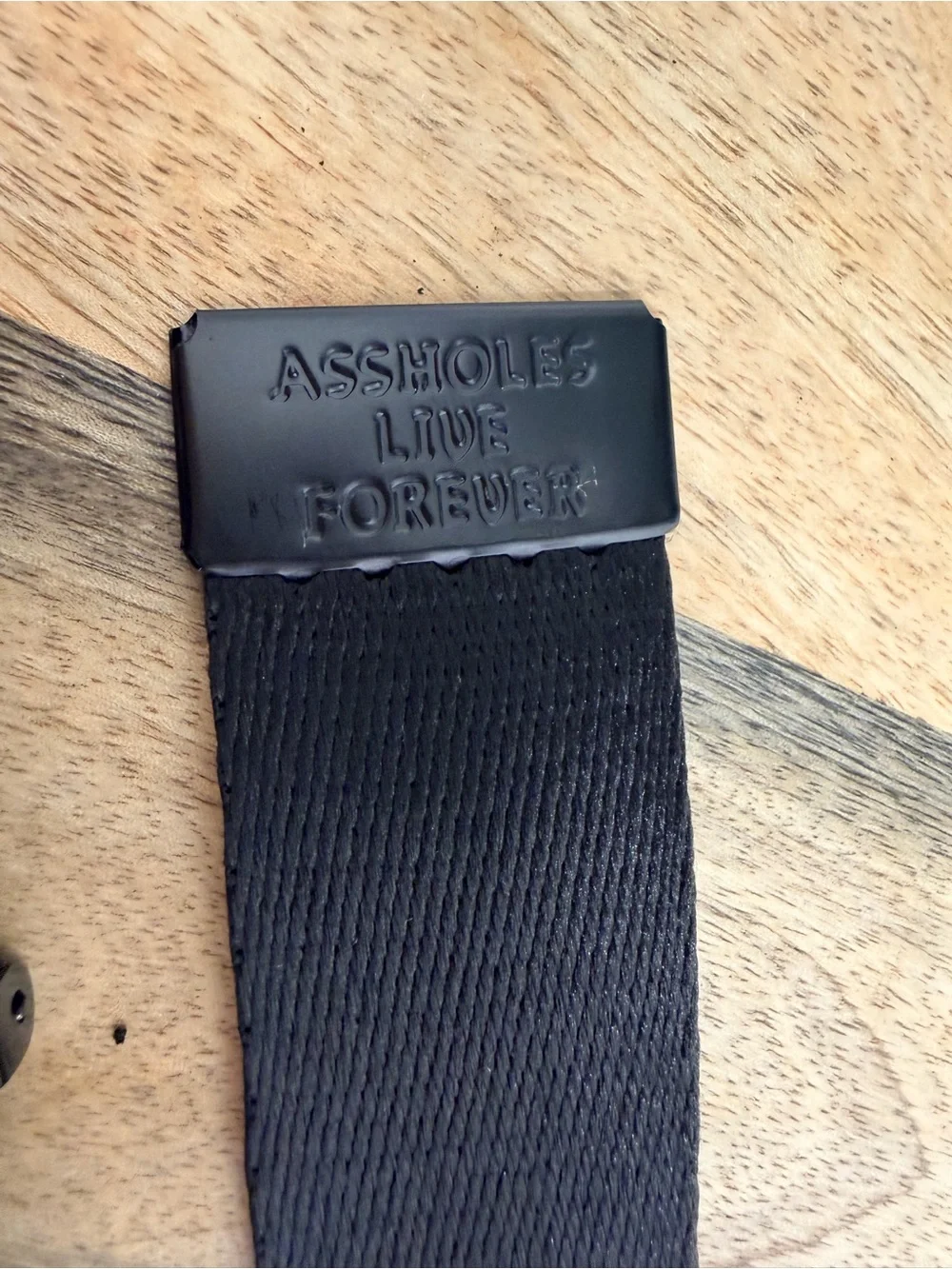 Black Belt with Pink 'ASSHOLES LIVE FOREVER' Text
